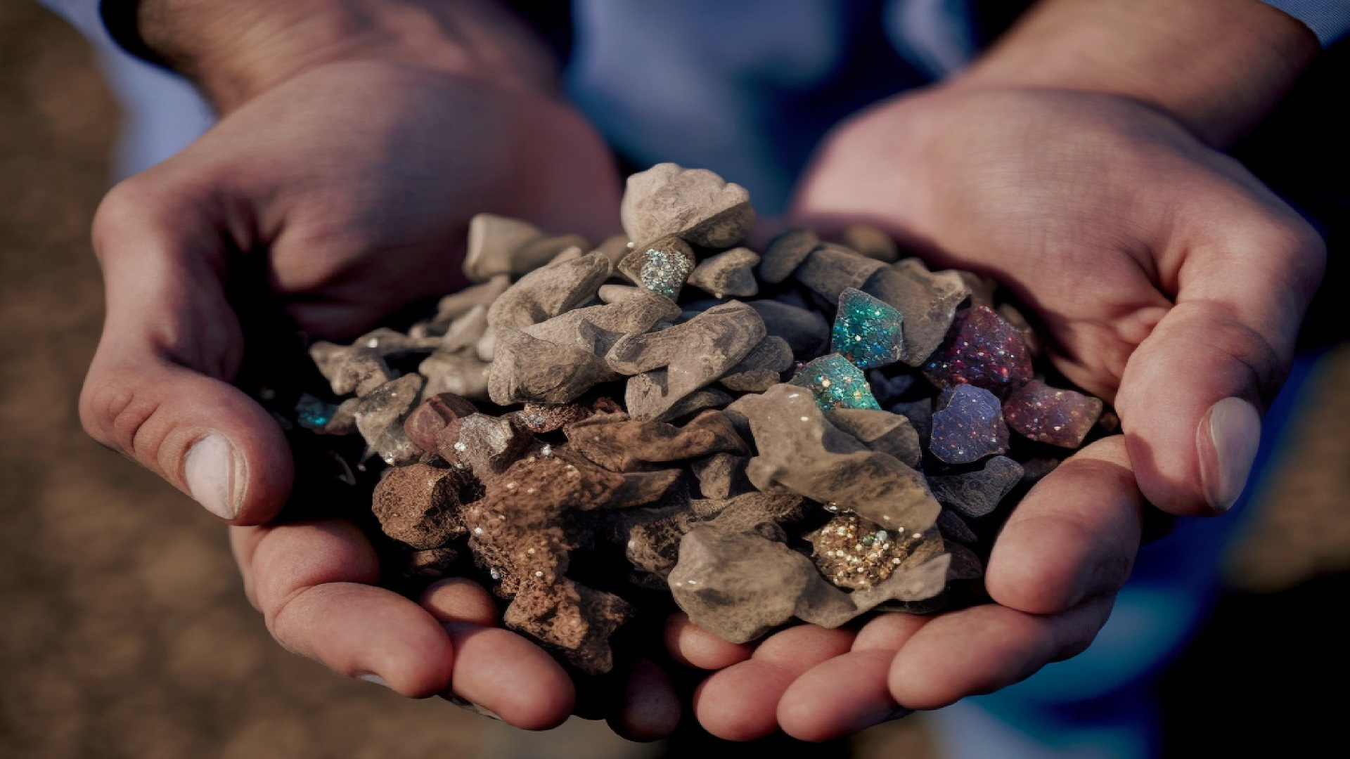 Mano sosteniendo elementos de tierras raras